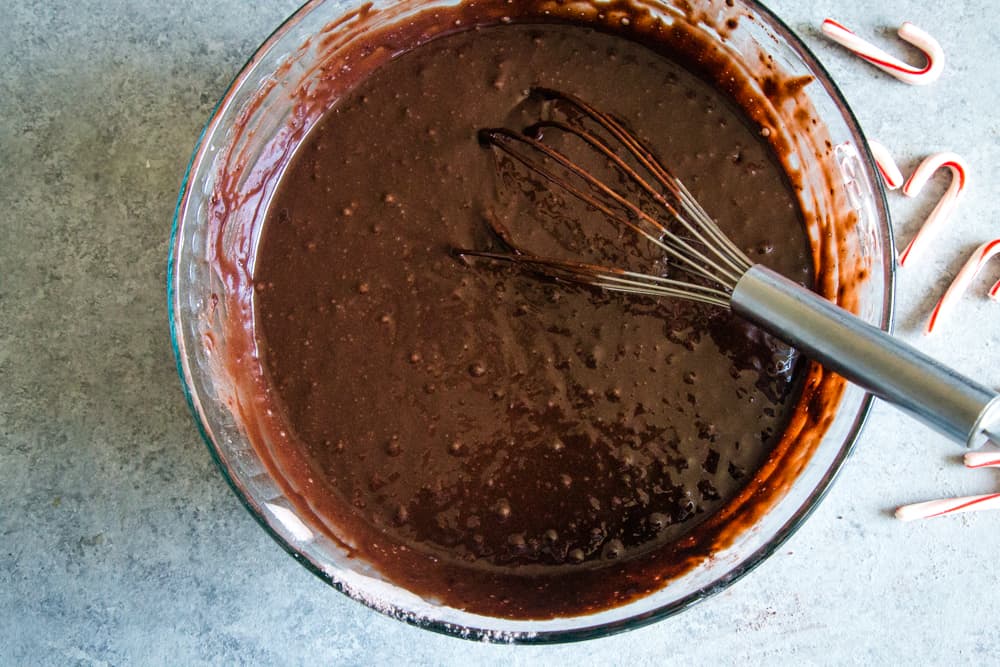 Final chocolate cake batter whisked until smooth in a large glass bowl. 