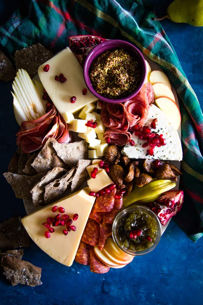 holiday cheeseboard on blue background