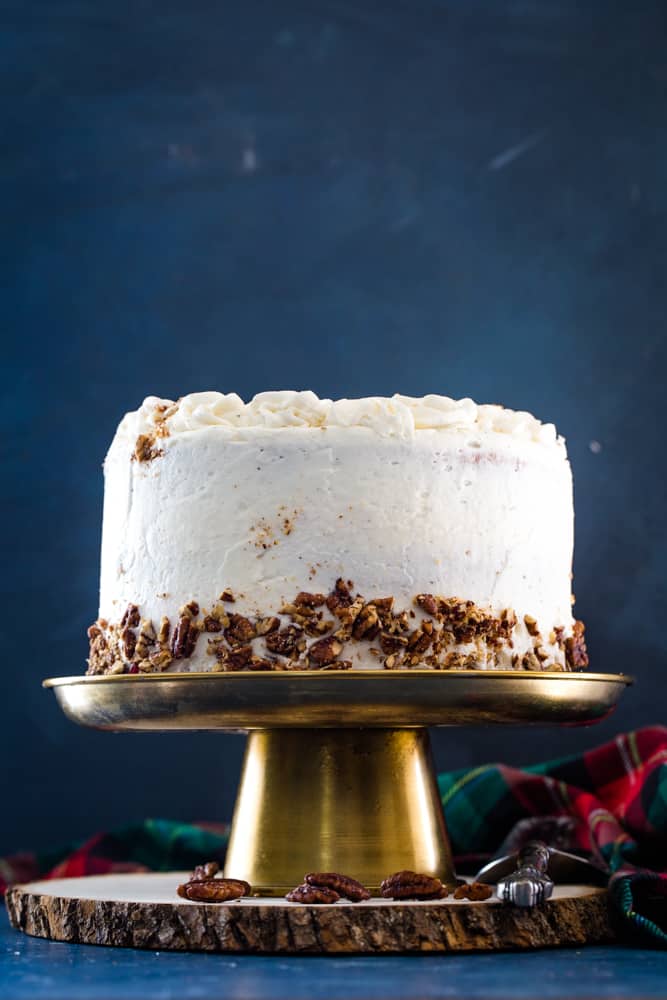 eggnog layer cake on a gold cake stand