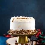 eggnog layer cake on a gold cake stand