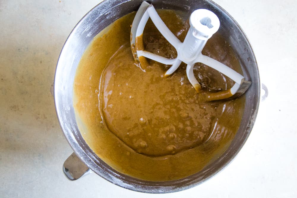 gingerbread layer cake batter in bowl with mixer