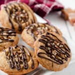 white plate with caramel cookie cups and red dish towel