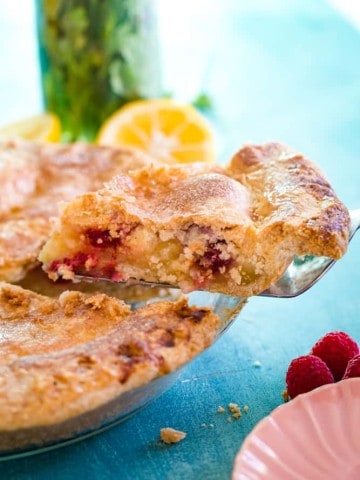 slice of lemon raspberry pie on pie slicer