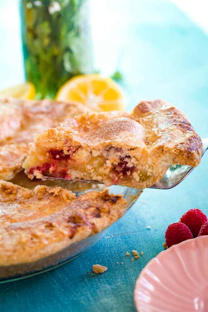 slice of lemon raspberry pie on pie slicer