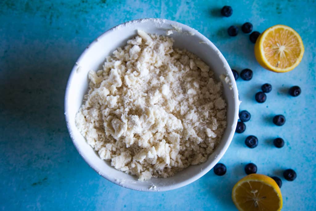 crumble topping for blueberry loaf in white bowl