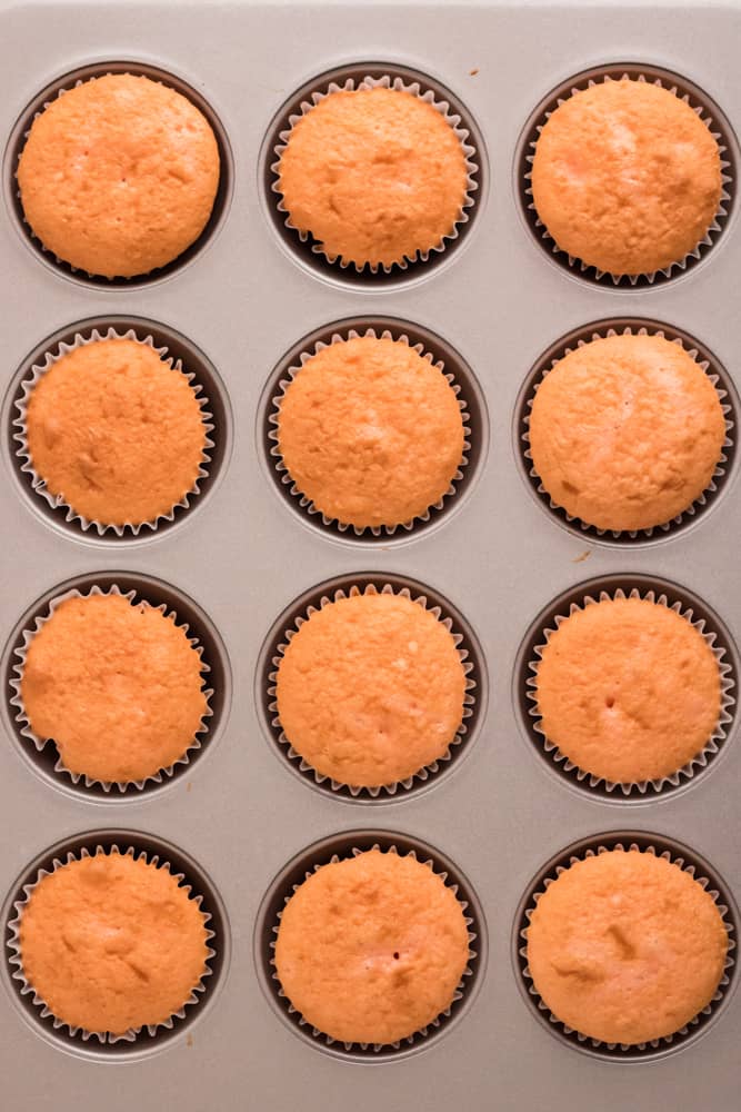 pan of 12 cooked pink champagne cupcakes