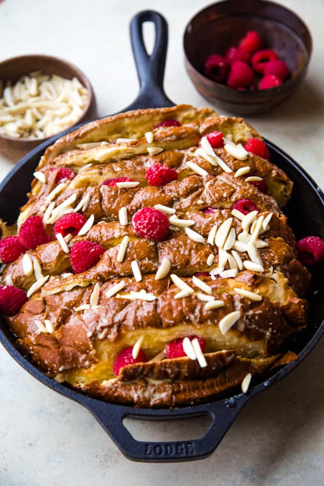 raspberry almond french toast in a cast iron pan