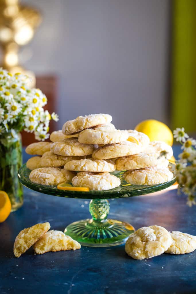 green cake stand with lemon bars cookies