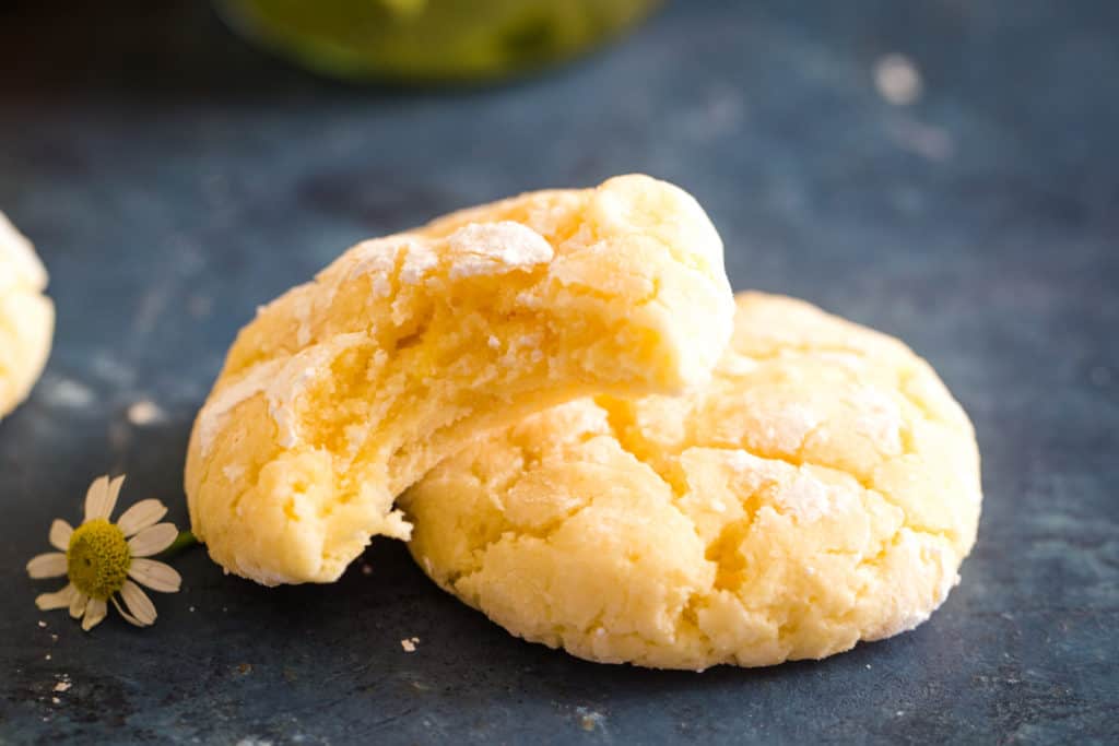 two lemon crinkle cookies with bite 