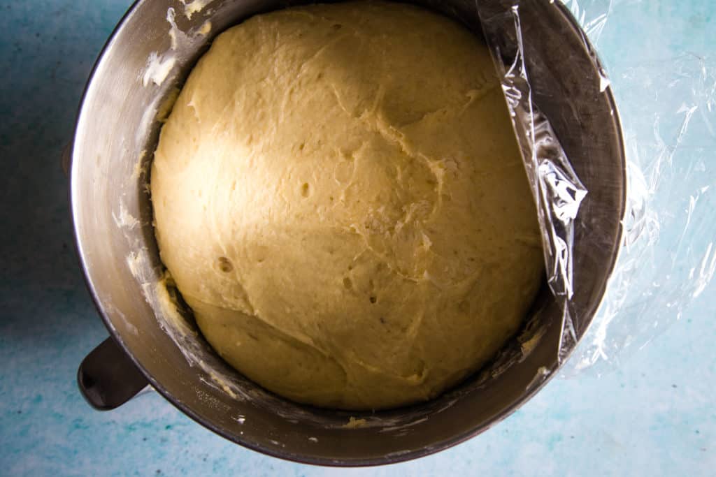 brioche dough that has doubled in size in metal mixing bowl