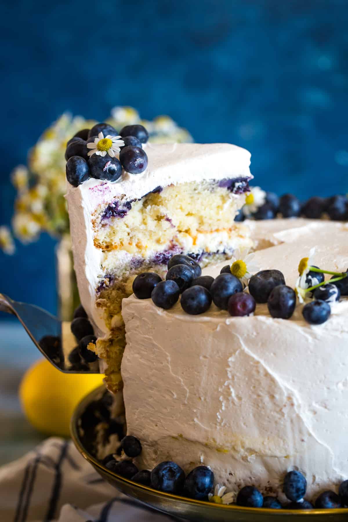 slice of blueberry cake with lemon curd