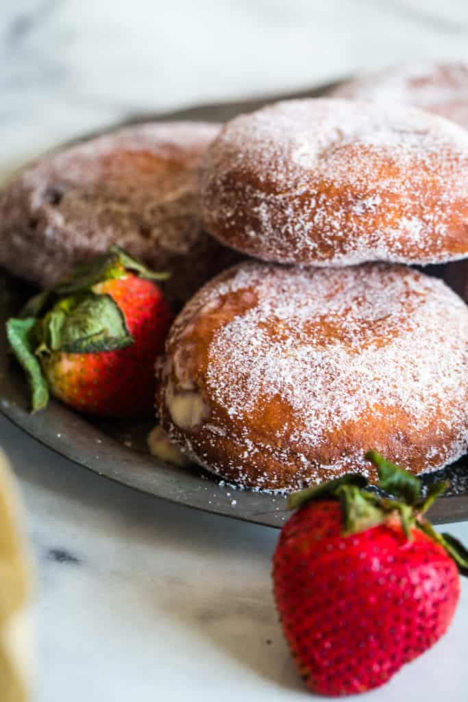 silver plate with strawberry custard filled donuts