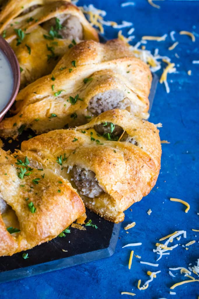 slices of meatball crescent ring on blue background