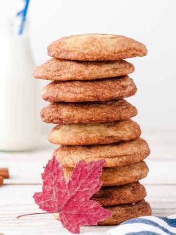 stack of maple snickerdoodle cookies with red maple leaf