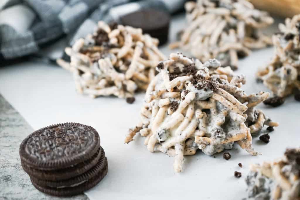 tray of cookies and cream haystack cookies with whole Oreos next to the stacks. 