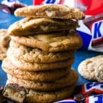 Stacked cookies with top cookie cut in half to show chocolate center.