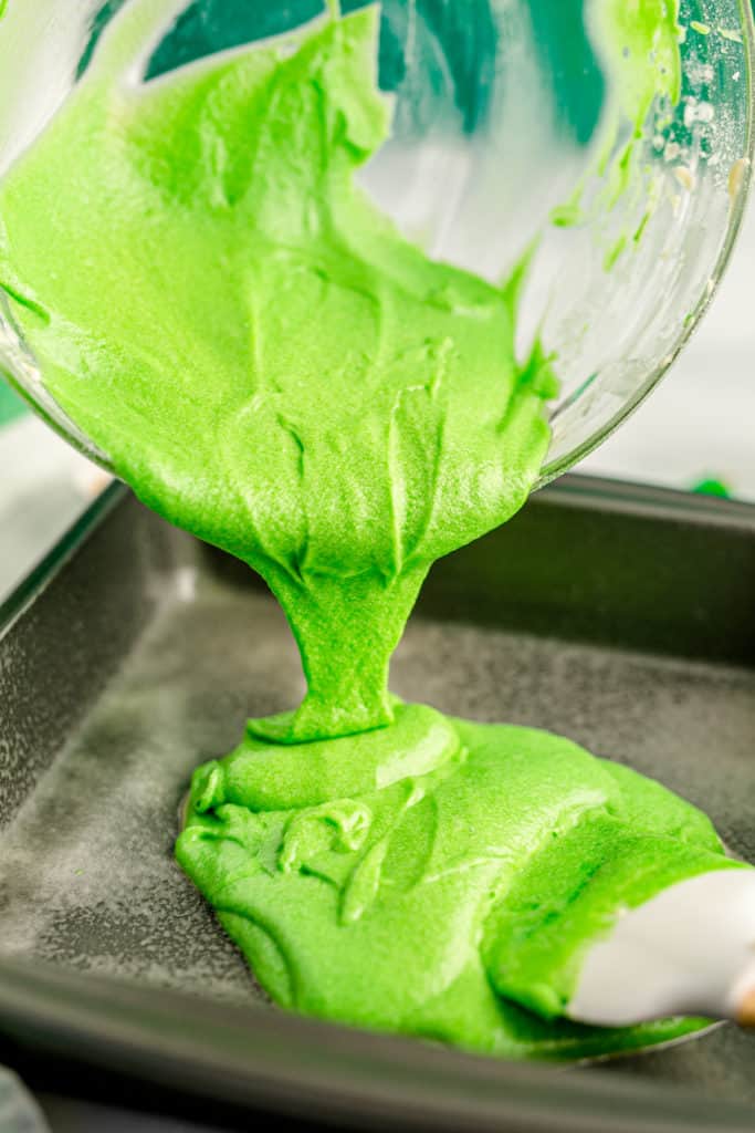 pouring green batter into pan