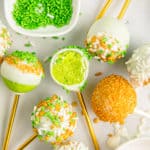 green cakes pops on a white background