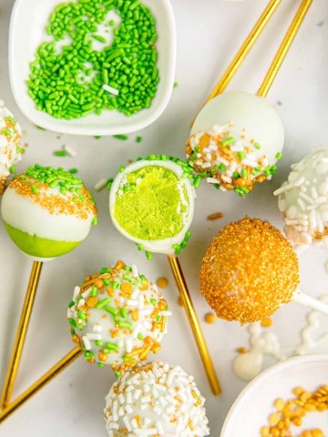 green cakes pops on a white background