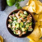 salmon ceviche in wood bowl with tortilla chips