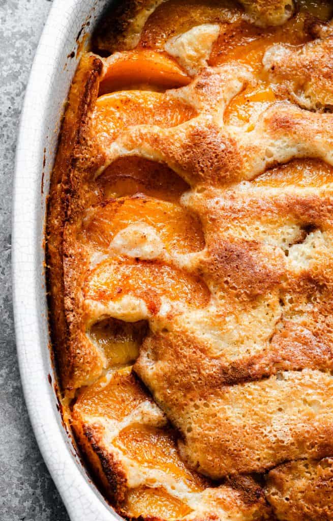 white oblong pan of peach cobbler