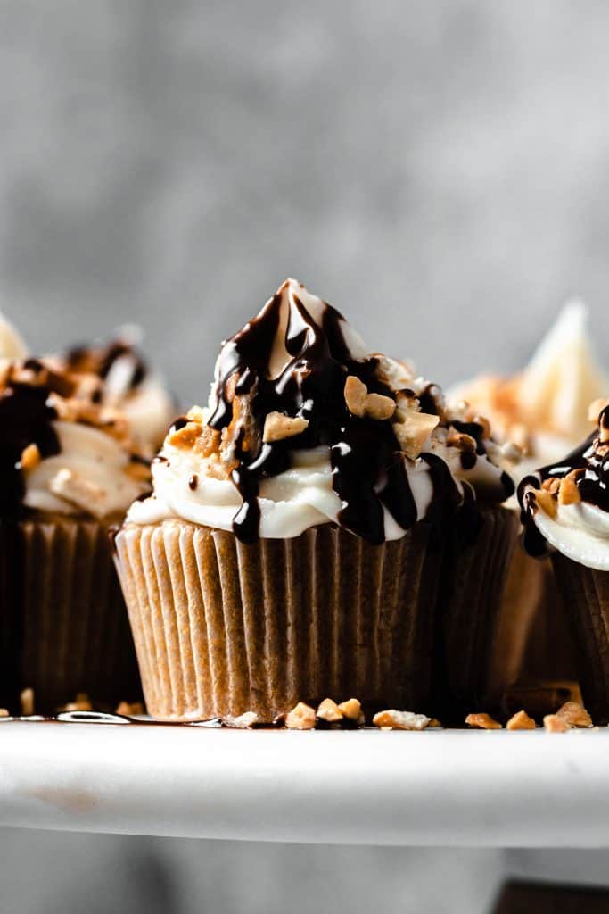 cupcakes on a cake plate with metal background