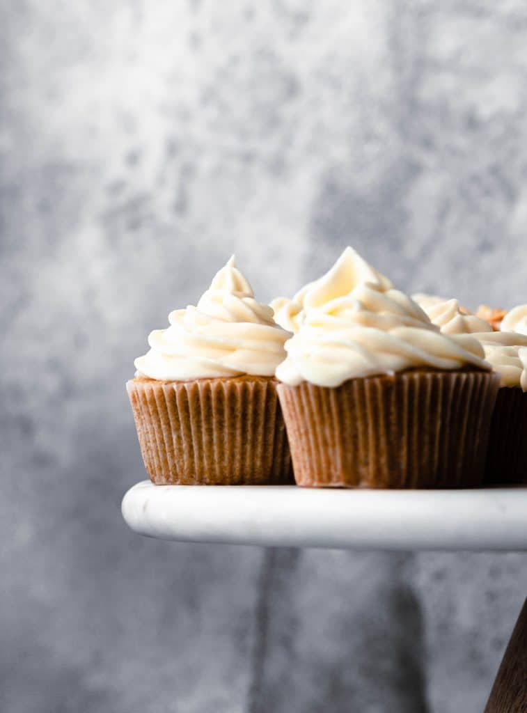 beer cupcakes on white cake plate