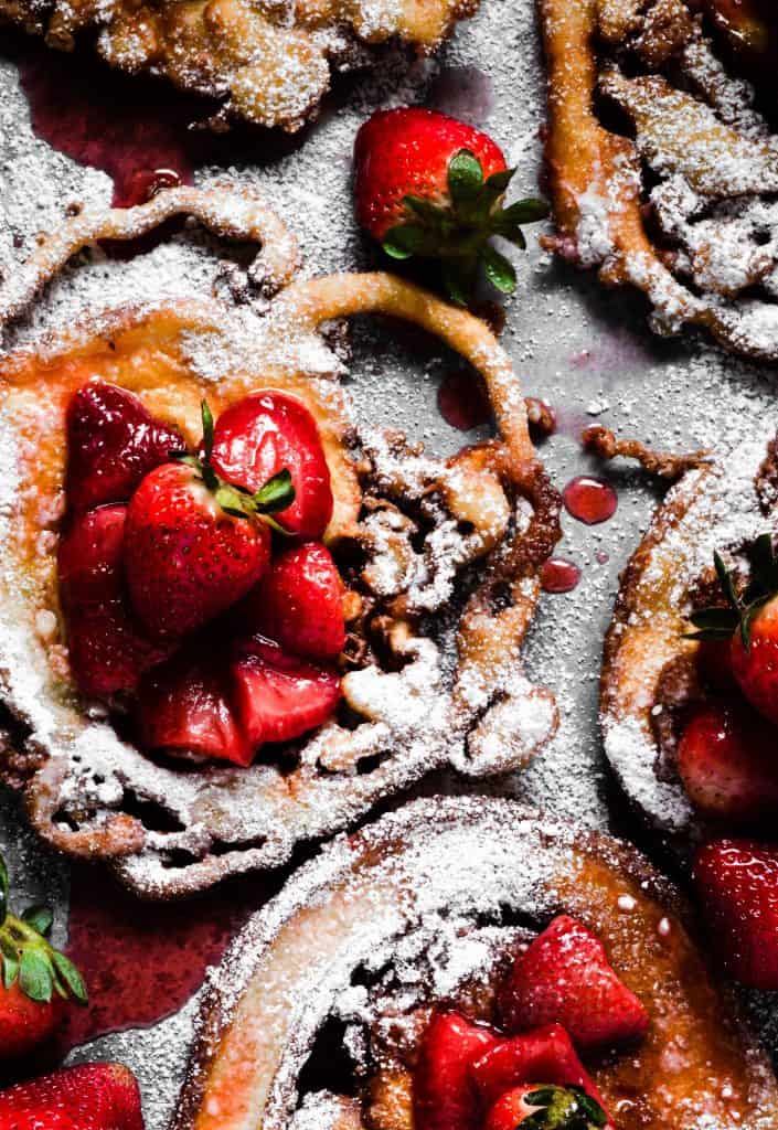 overhead shot of garnished funnel cakes