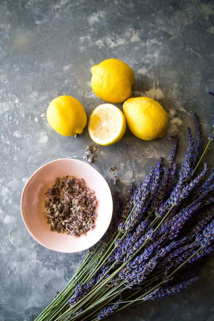 ingredients to make lavender lemonade on metal background