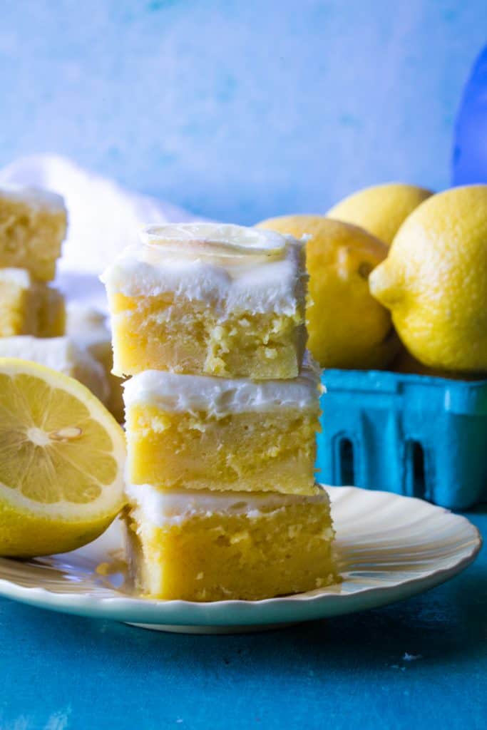 plate of 3 lemon brownies on b Lue background