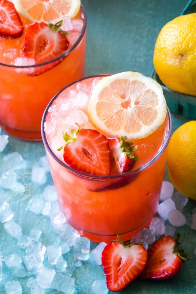 up close shot of strawberry lemonade with strawberry and lemon slice garnish