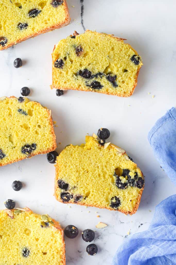 slices of pumpkin blueberry bread on white background