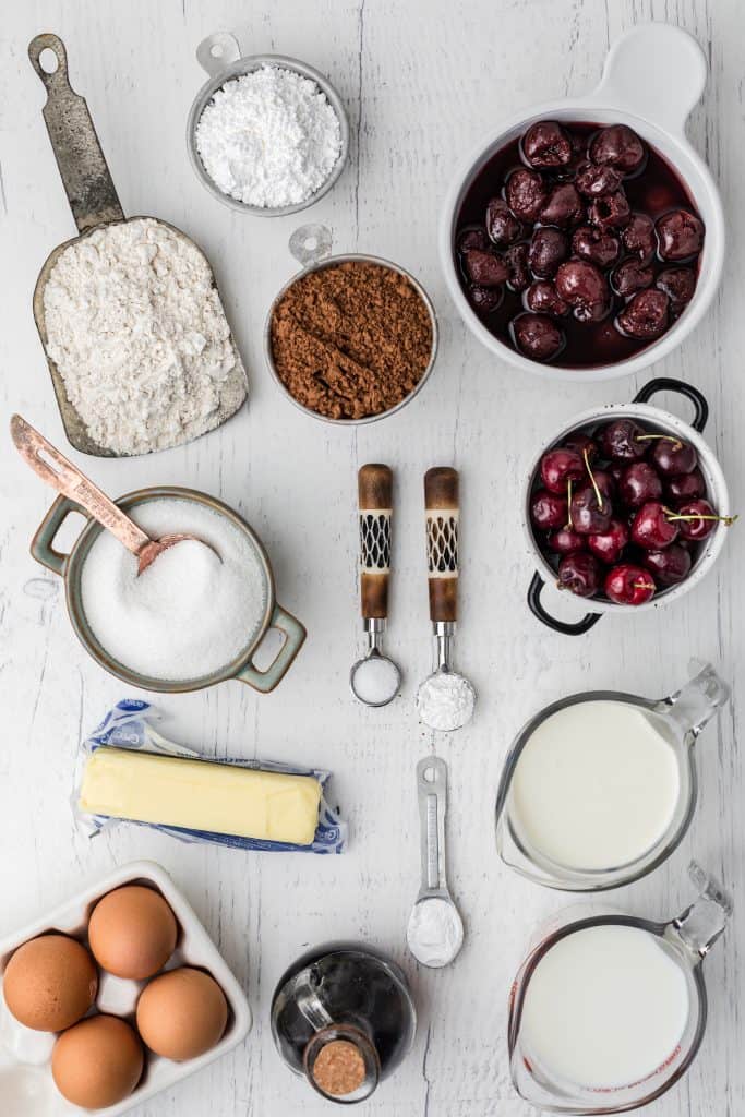 ingredients for Black Forest cake on white background