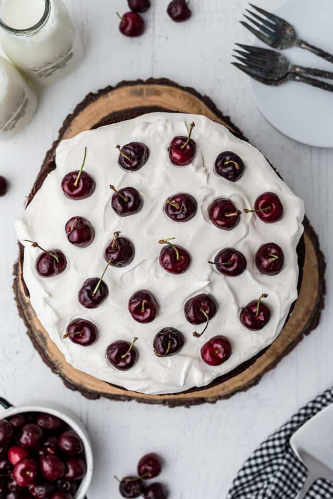 layering the cherries on the whipped cream