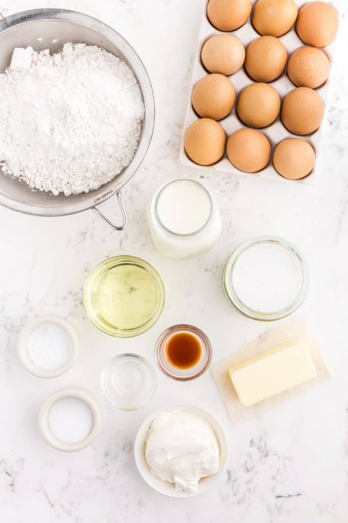 white cupcakes ingredients on white background