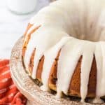 pumpkin chocolate chip Bundt Cake on wooden cake plate