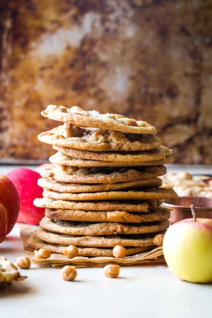 stack of caramel apple cookies with metal background