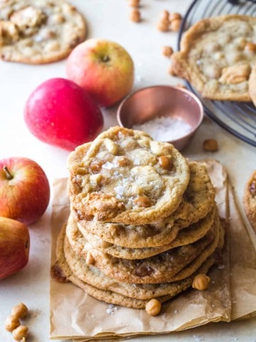 stack of caramel apple cookies on brown parchment paper