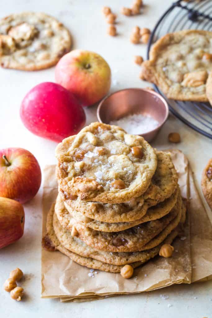 stack of caramel apple cookies on brown parchment paper