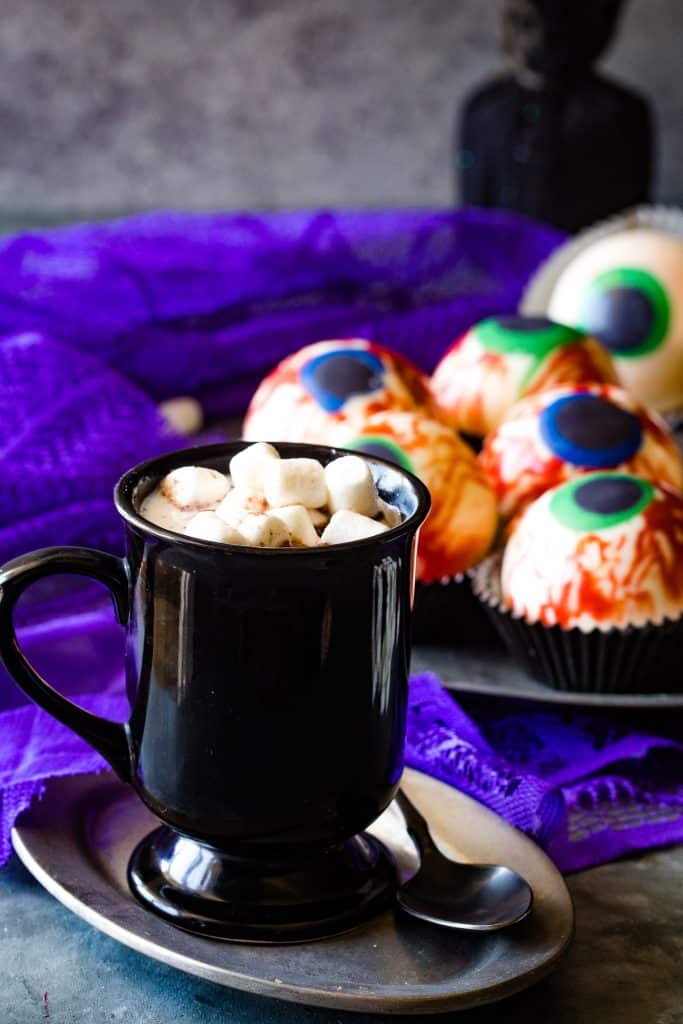 black mug with hot chocolate