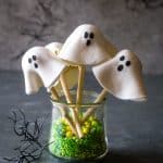 donut hole ghosts in a cup with green sprinkles