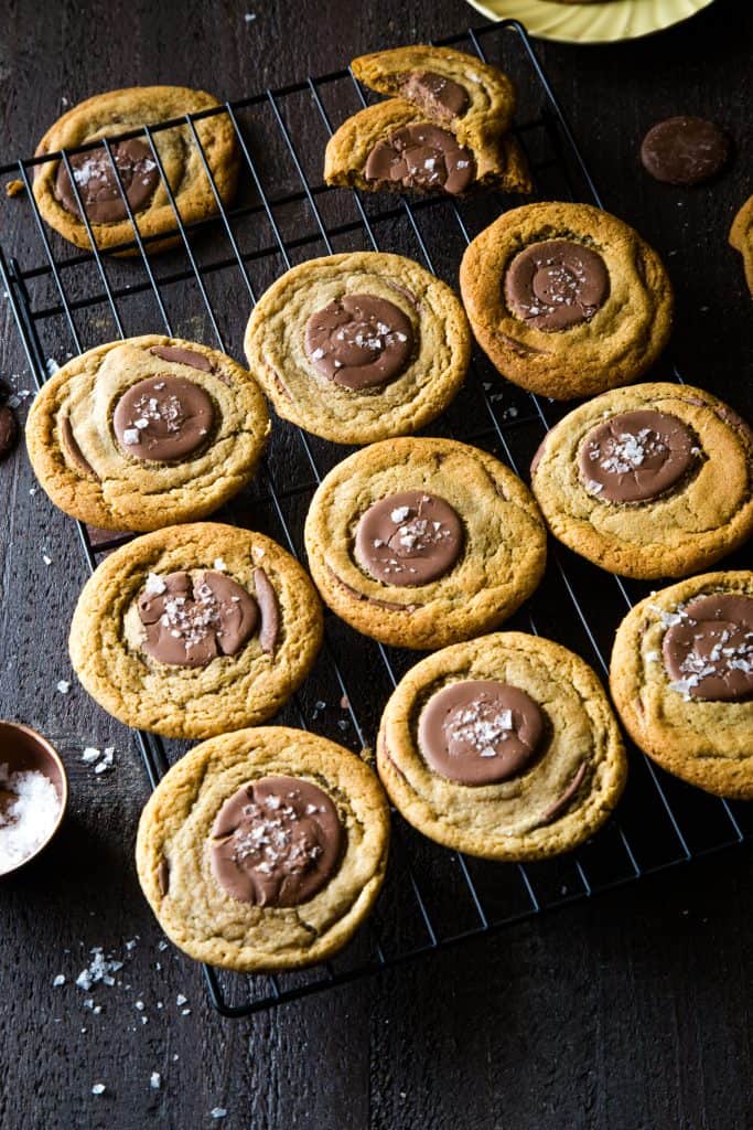 cooling rack stacked with whole wheat chocolate cookies