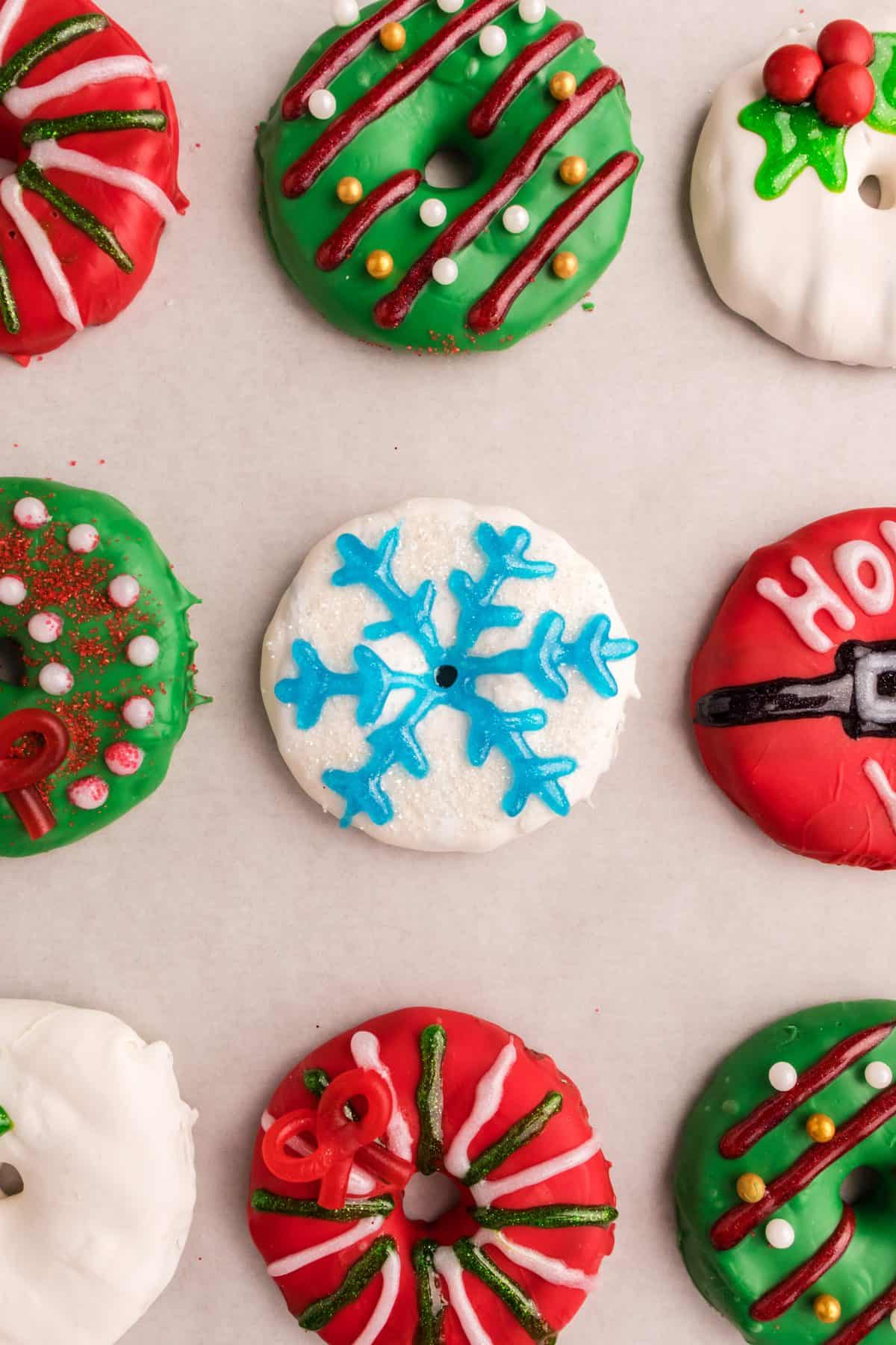 up close shot of Christmas wreath cookies on white sheet