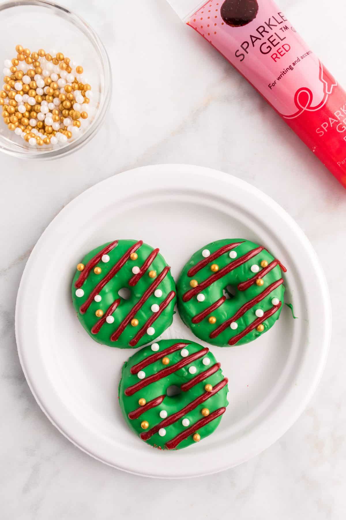 green Christmas wreath cookies with stripes and pearl sprinkles