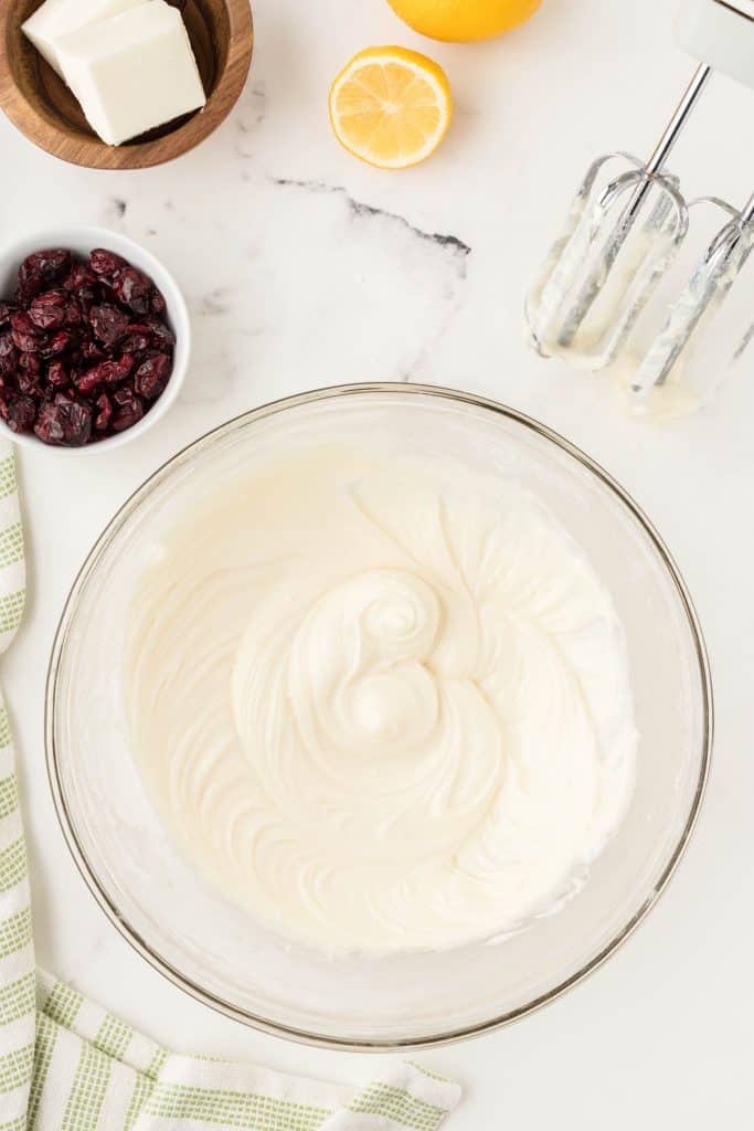 whipped cream cheese frosting in glass bowl