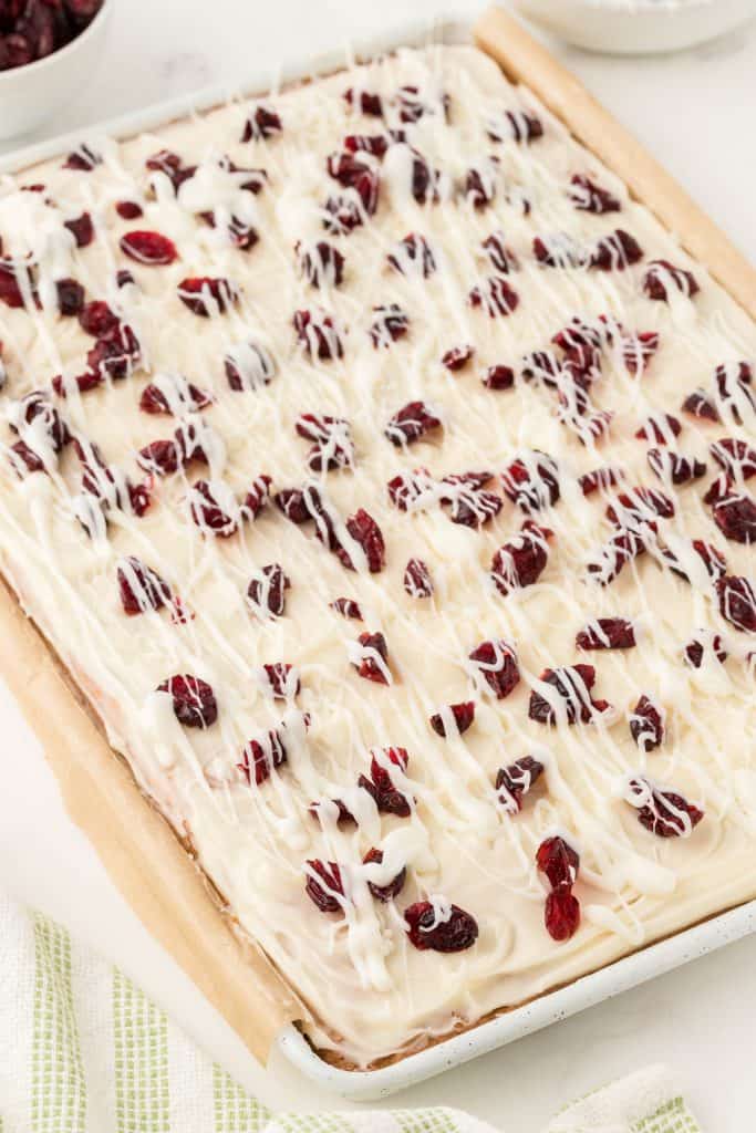 slab of cranberry bliss bar with drizzled white chocolate