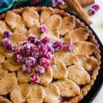 whole cranberry tart on black plate