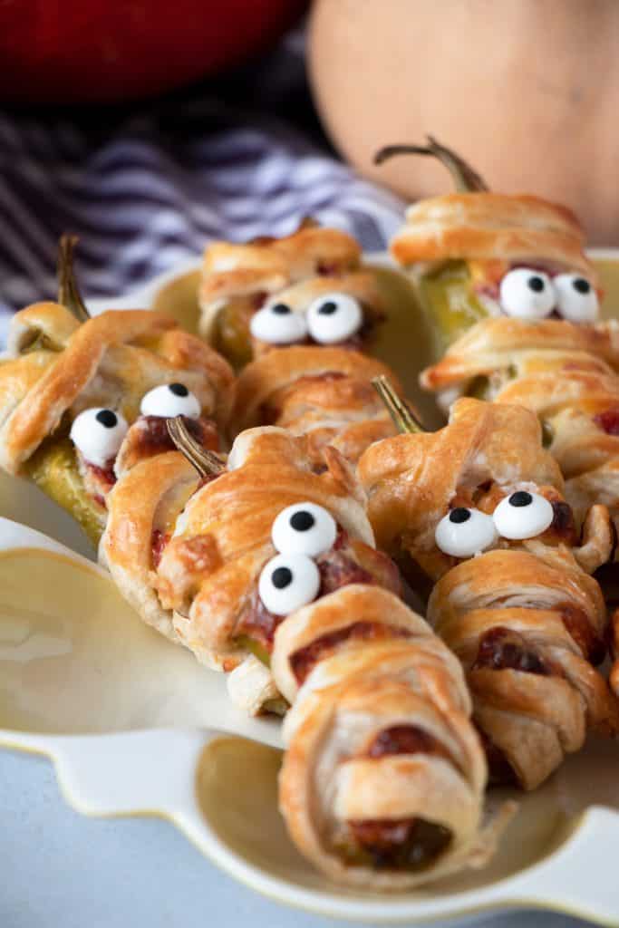 halloween jalapeno mummies in a serving dish