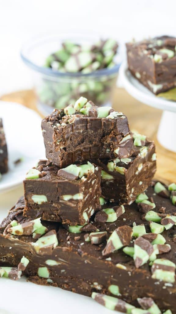 stacked mint chocolate fudge with a bite taken out