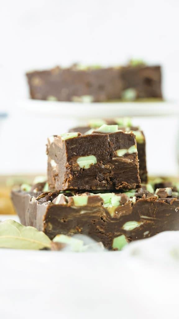 cut mint chocolate fudge on white background